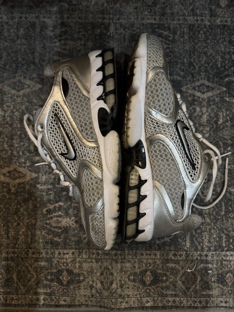 nike spiridon (Category: Sneakers) located in Manila. Submitted by ecooo (Listing ID 1436075116, Image 1). Description: used like new size 11 - Silver Nike Zoom Air sneakers - Breathable mesh upper with silver accents - Clean white sole - Nike swoosh branding on the sides - Red Nike logo and "Zoom Air" branding on the heel - Classic white laces.