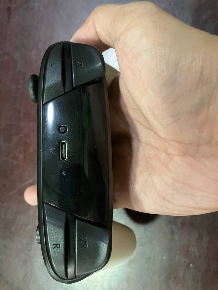Nintendo Switch Pro Controller (Category: Controllers) located in Marikina City. Submitted by lasgna (Listing ID 1436063335, Image 3). Description: FOR SALE AS A BUNDLE ONLY - Nintendo Switch Pro Controller - Unique black and white design - Includes a carrying case - Standard button layout - Analog sticks - USB-C charging port Issues: - Left Joycon connection issues - Cosmetic Issue No other issues. Payment via Gcash, Maya, Gotyme Buyer shoulders