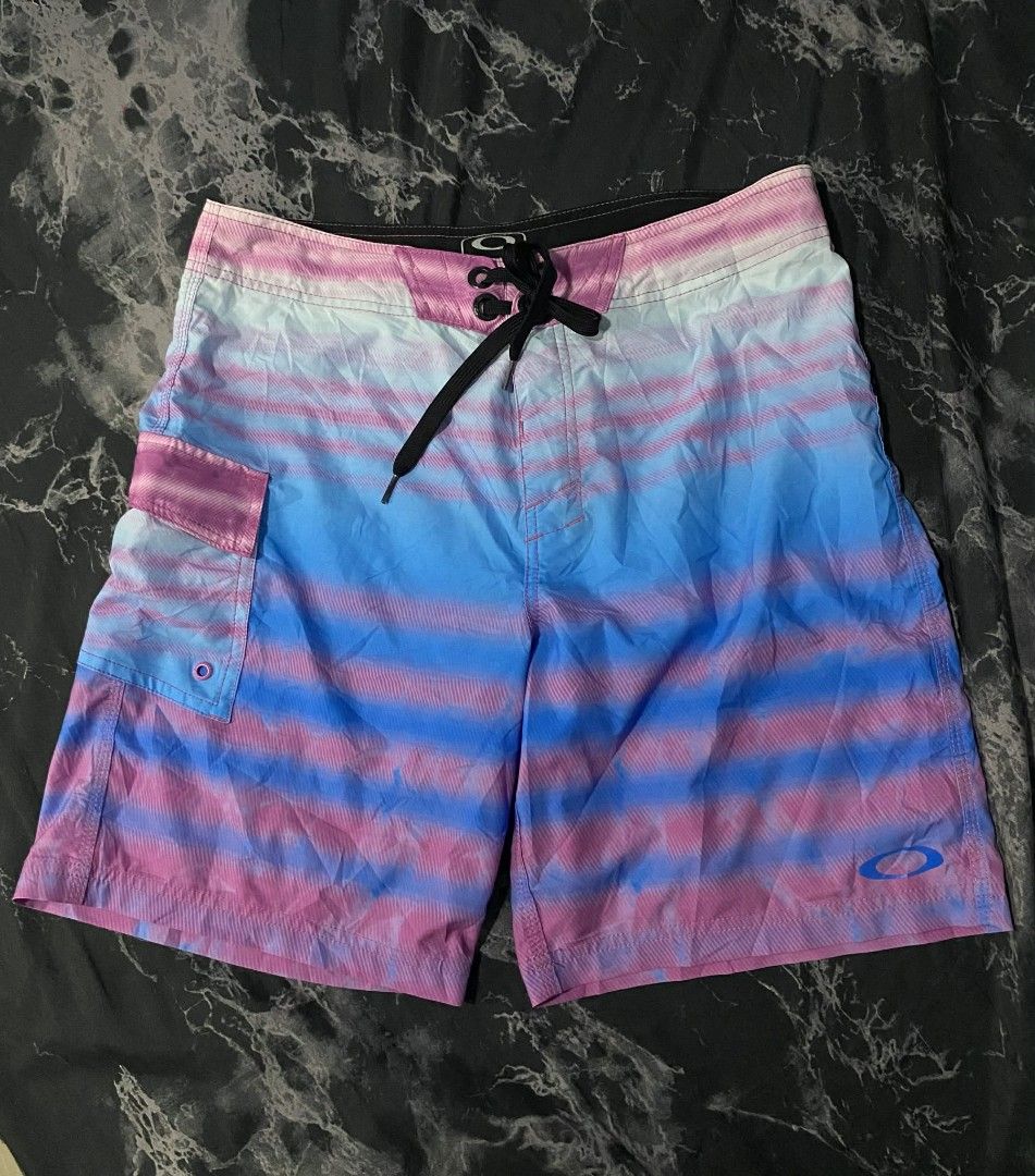 Oakley Board Short (Category: Shorts) located in Bago City. Submitted by classic_picked_up (Listing ID 1436014078, Image 1). Description: Like New Pink & Blue Gradient Authentic Waist: 34-36 Length: 19 Leg Opening:11.5 No issue Cut washtag only, legit 💯.