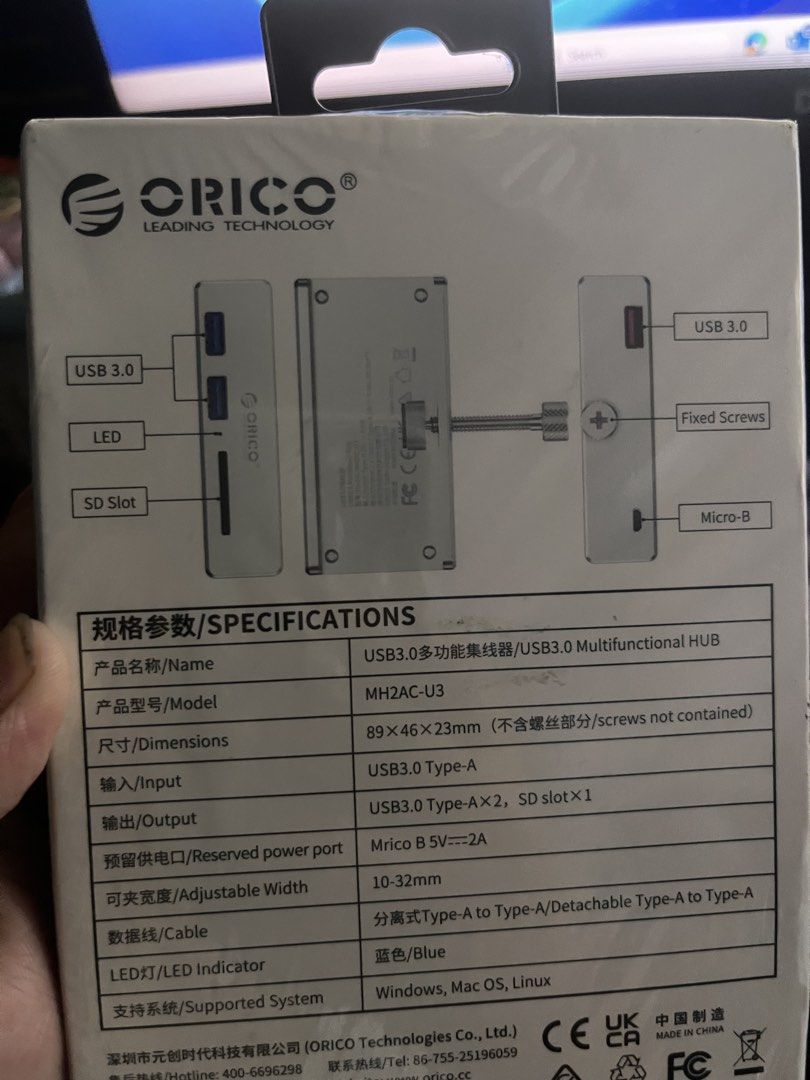 ORICO Multifunctional Hub MH2AC-U3 (Category: Cables & Adaptors) located in Cavite. Submitted by tifanny.goods (Listing ID 1436012232, Image 2). Description: - ORICO Multifunctional Hub with 2 USB 3.0 ports and 1 SD card slot. - Clip design for easy placement. - Supports various storage devices. - 5Gbps transfer rate. - Includes Micro-B port. - Compatible with Windows, Mac OS, and Linux..