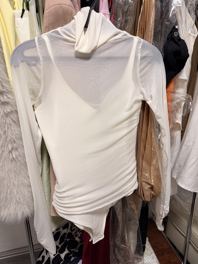 Patton Mesh Long Sleeve High Neck Bodysuit (Category: Others Tops) located in Manila. Submitted by limkatrina85186 (Listing ID 1436078650, Image 2). Description: - Patton white bodysuit used once only - High neck design - Long mesh sleeves - V-neckline - Fitted silhouette - Includes a built-in tank top layer - Smooth, form-fitting fabric - One-piece garment - Original price: ₱5,795.