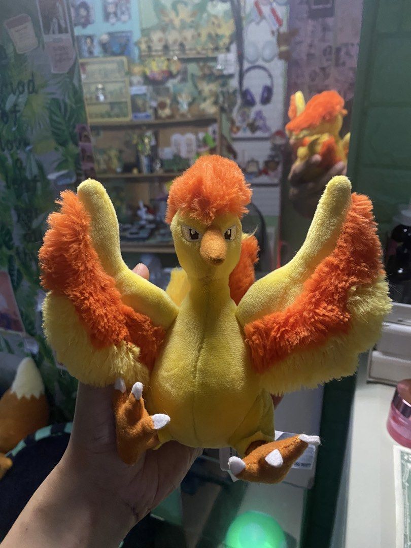 Pokemon Fit Moltres Plush Toy (Category: Plushies & Soft Toys) located in Manila. Submitted by jongamba0773283 (Listing ID 1436092284, Image 1). Description: - Pokemon Center Moltres plush. - Features bright yellow and orange colors. - Detailed wings and fiery crest. - Comes with a tag. - Great for Pokemon fans and collectors..