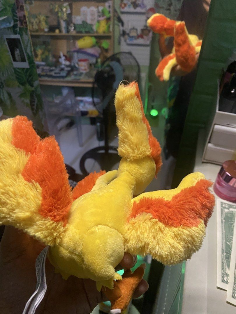 Pokemon Fit Moltres Plush Toy (Category: Plushies & Soft Toys) located in Manila. Submitted by jongamba0773283 (Listing ID 1436092284, Image 3). Description: - Pokemon Center Moltres plush. - Features bright yellow and orange colors. - Detailed wings and fiery crest. - Comes with a tag. - Great for Pokemon fans and collectors..