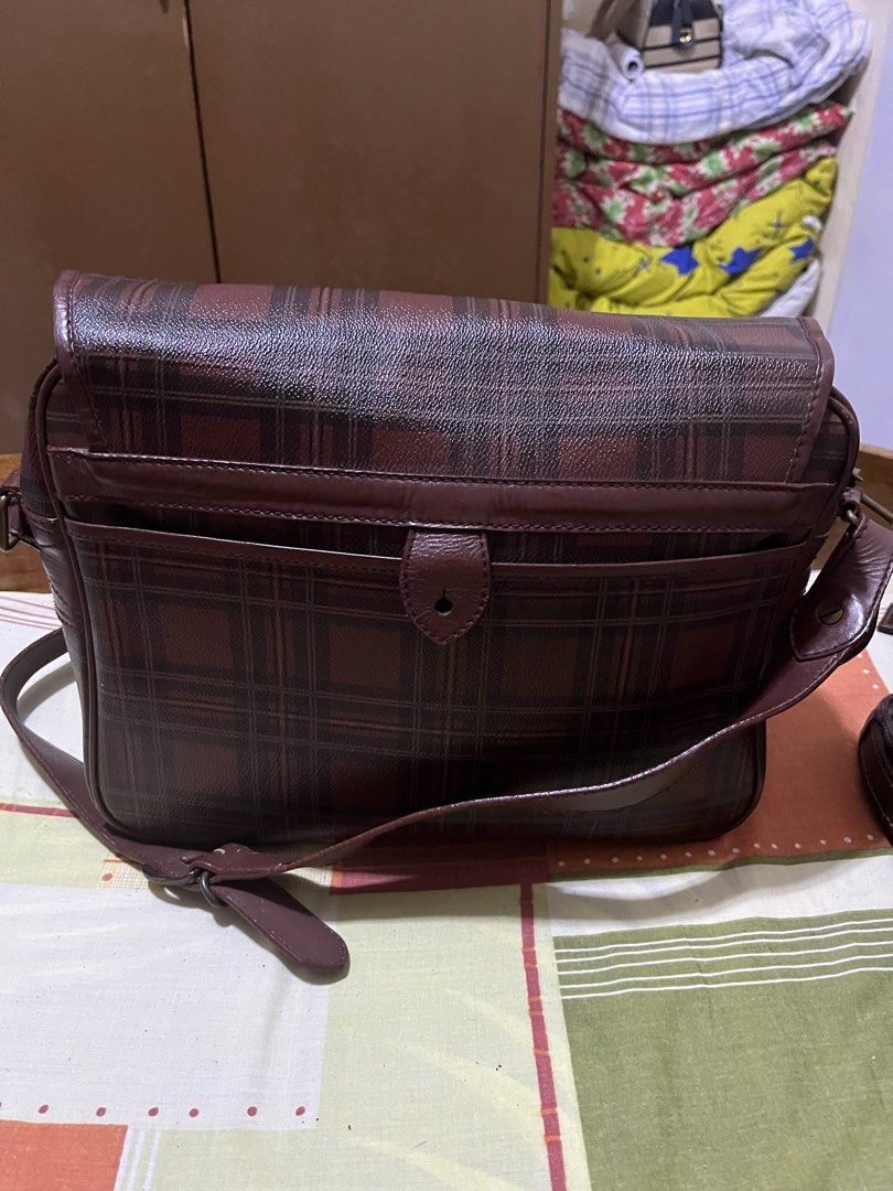 Polo Ralph Lauren Plaid Shoulder Bag (Category: Luxury Bags & Wallets) located in Manila. Submitted by jankbaiteh05162 (Listing ID 1435917331, Image 2). Description: - Polo Ralph Lauren shoulder bag - Plaid pattern - Leather material - Flap closure with two buckles - Front pocket - Adjustable shoulder strap - Features a small logo plate - Shows wear on strap and closure.