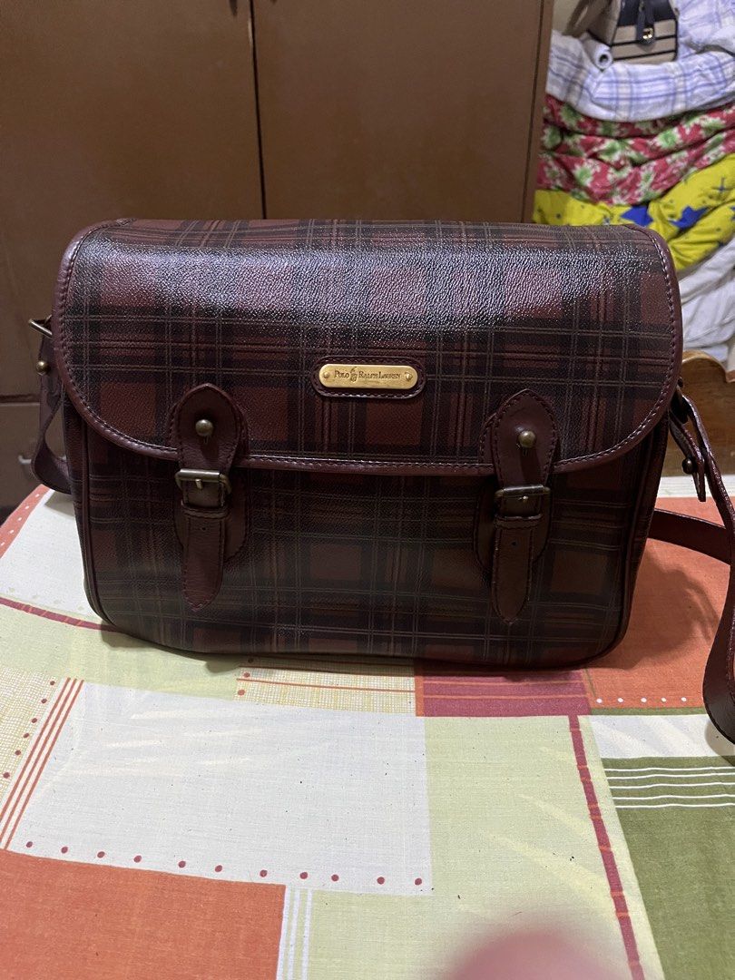 Polo Ralph Lauren Plaid Shoulder Bag (Category: Luxury Bags & Wallets) located in Manila. Submitted by jankbaiteh05162 (Listing ID 1435917331, Image 1). Description: - Polo Ralph Lauren shoulder bag - Plaid pattern - Leather material - Flap closure with two buckles - Front pocket - Adjustable shoulder strap - Features a small logo plate - Shows wear on strap and closure.