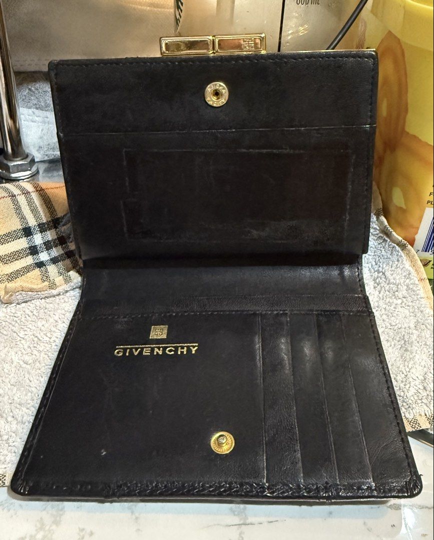 Preloved Vintage Givenchy Black Bifold Kisslock Leather Wallet (Category: Wallets & Card holders) located in Caloocan City. Submitted by bennetjohn072020 (Listing ID 1435938347, Image 3). Description: Preloved wallet from Japan See picture for the flaws Authentic Givenchy Manage expectation Pm if you have questions .