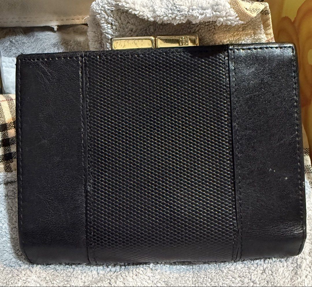 Preloved Vintage Givenchy Black Bifold Kisslock Leather Wallet (Category: Wallets & Card holders) located in Caloocan City. Submitted by bennetjohn072020 (Listing ID 1435938347, Image 2). Description: Preloved wallet from Japan See picture for the flaws Authentic Givenchy Manage expectation Pm if you have questions .