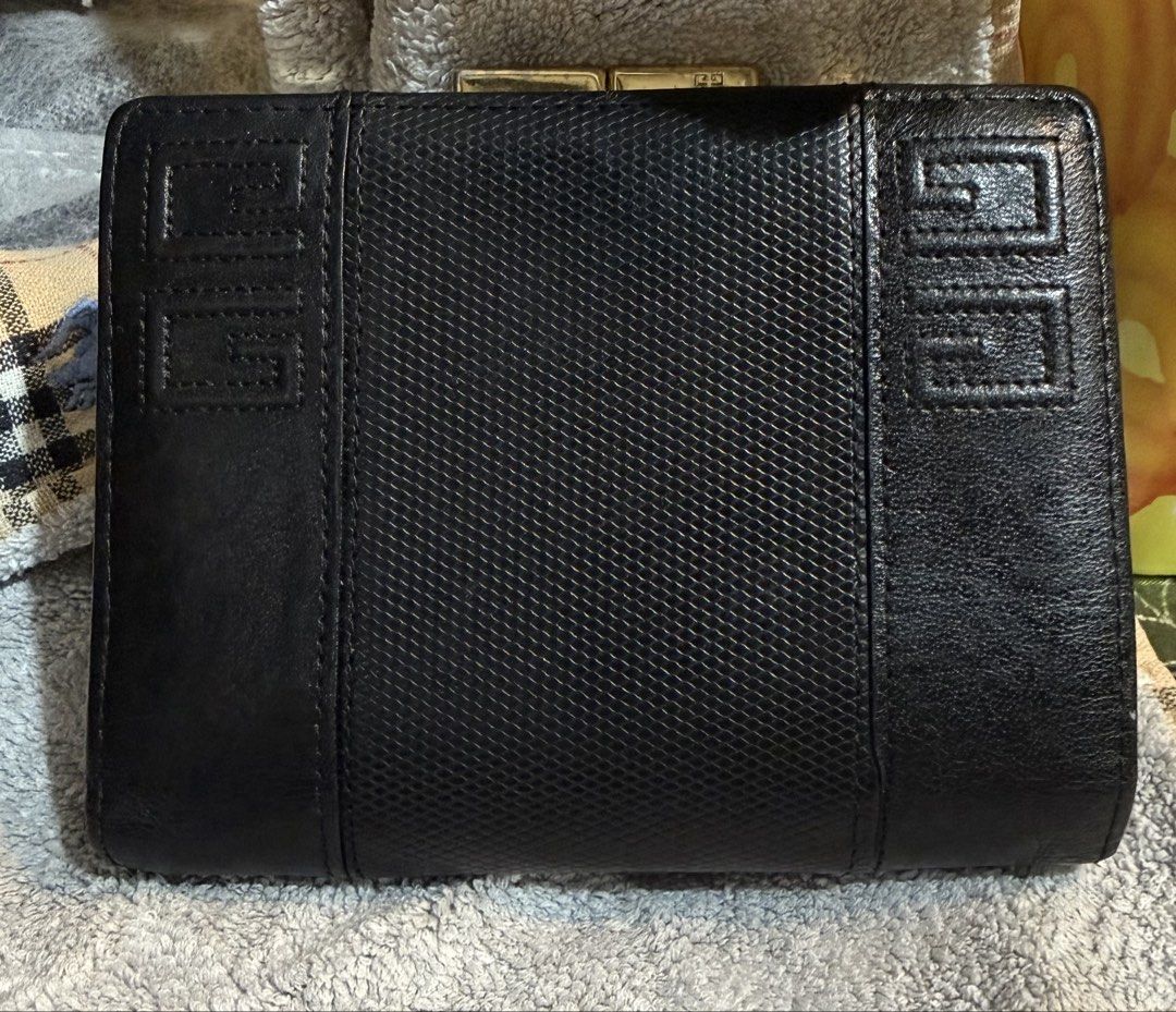 Preloved Vintage Givenchy Black Bifold Kisslock Leather Wallet (Category: Wallets & Card holders) located in Caloocan City. Submitted by bennetjohn072020 (Listing ID 1435938347, Image 1). Description: Preloved wallet from Japan See picture for the flaws Authentic Givenchy Manage expectation Pm if you have questions .