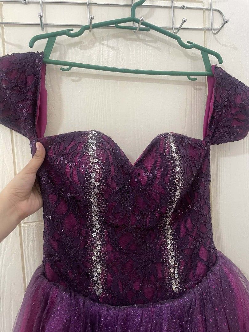 Purple Off-Shoulder Evening Dress (Category: Evening dresses & gowns) located in Manila. Submitted by padinlouis09933 (Listing ID 1436052141, Image 2). Description: - Elegant purple evening dress - Off-shoulder design - Sweetheart neckline - Bodice with lace and sequins - Flowing layered tulle skirt - Lace-up back - Perfect for special occasions.