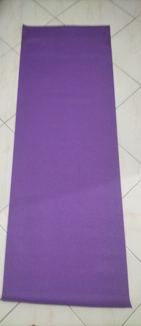 Purple Yoga Mat (Category: Exercise Mats) located in Las Pinas. Submitted by declutter.with.eca (Listing ID 1435914916, Image 1). Description: - Purple yoga mat - Made of foam-like material - Ideal for exercise and stretching.