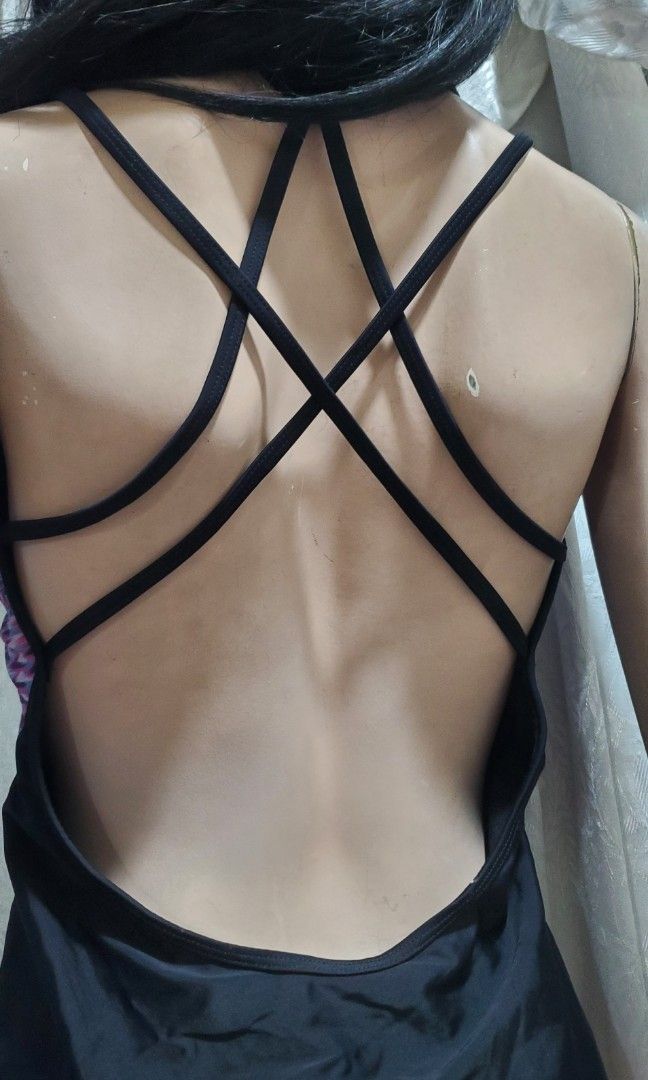 RBX Swimsuit - Large (Category: Bikinis & Swimsuits) located in Manila. Submitted by gresha (Listing ID 1436082703, Image 3). Description: - RBX swimsuit - Size: Large - Features a vibrant geometric pattern - Criss-cross back design - Scoop back - Black trim and straps.