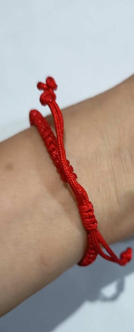 Red String Donut Jade Bracelet (Category: Bracelets) located in Famy. Submitted by potato.label (Listing ID 1436001714, Image 2). Description: - Red string bracelet - Features a donut jade stone - Jade stone has a light purple hue - Adjustable sliding knot closure - Donut in Chinese culture symbolizes eternal protection - Suitable for daily wear.