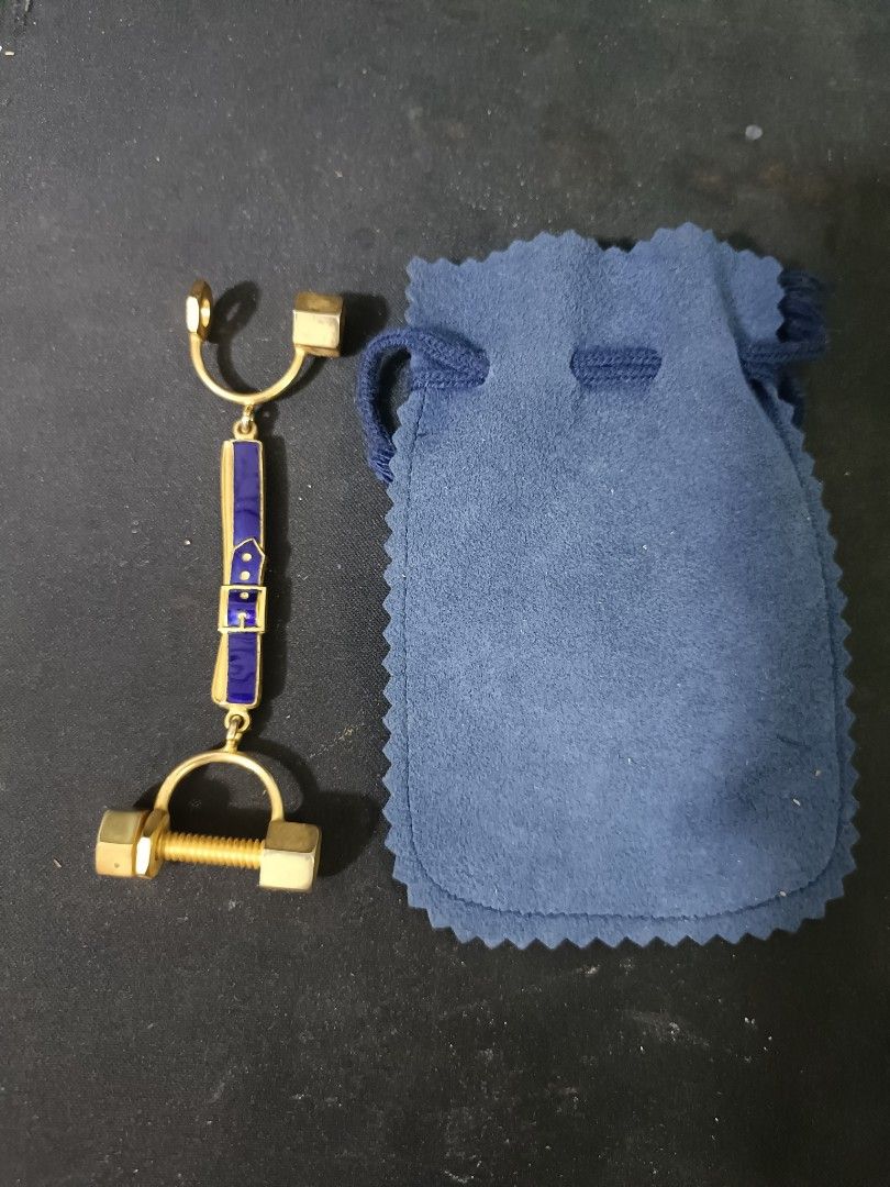 Roberta di Camerino Vintage Key Holder (Category: Purses & Pouches) located in Manila. Submitted by japoy22 (Listing ID 1436090139, Image 1). Description: Roberta di Camerino Vintage Key Holder P 1,800 Brand: Roberta di Camerino (Authentic hallmark visible on reverse). Motif: Features the iconic "belt and buckle" enamel work in signature navy blue, sandwiched between literal nut-and-bolt hardware. Material: Gold-toned base metal with high-quality