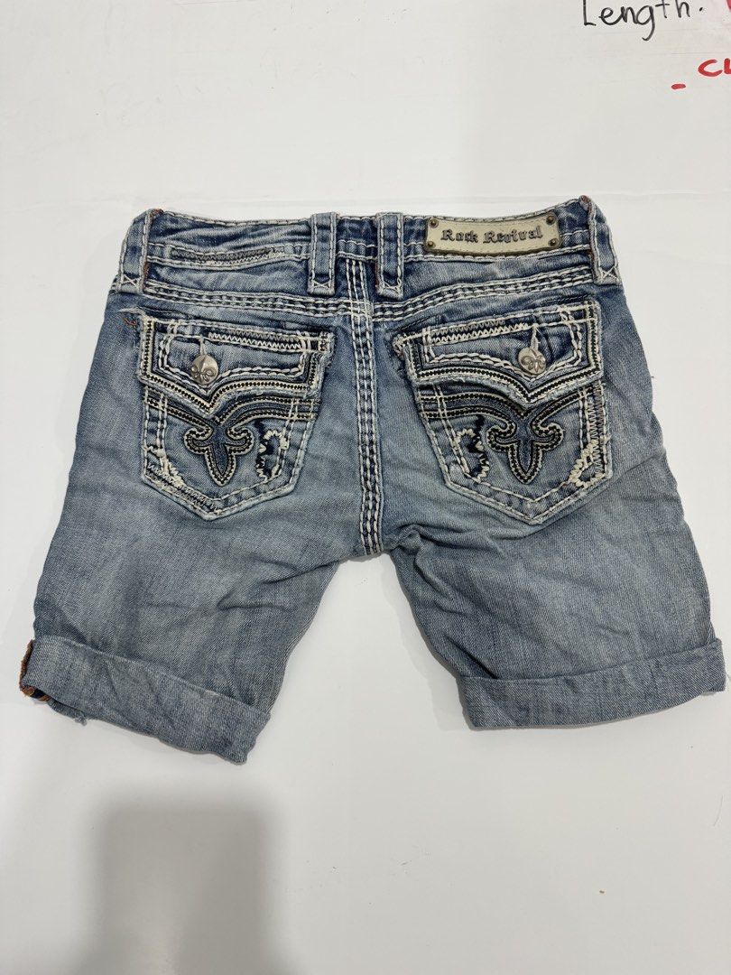 Rock Revival Denim Shorts (Category: Shorts) located in Cebu City. Submitted by oryenz (Listing ID 1436040330, Image 1). Description: - Rock Revival denim shorts - Size 24 - Light blue wash - Distressed accents - Rock Revival logo on back pocket and waistband - Button and zipper closure - Designed in the USA, made in China.