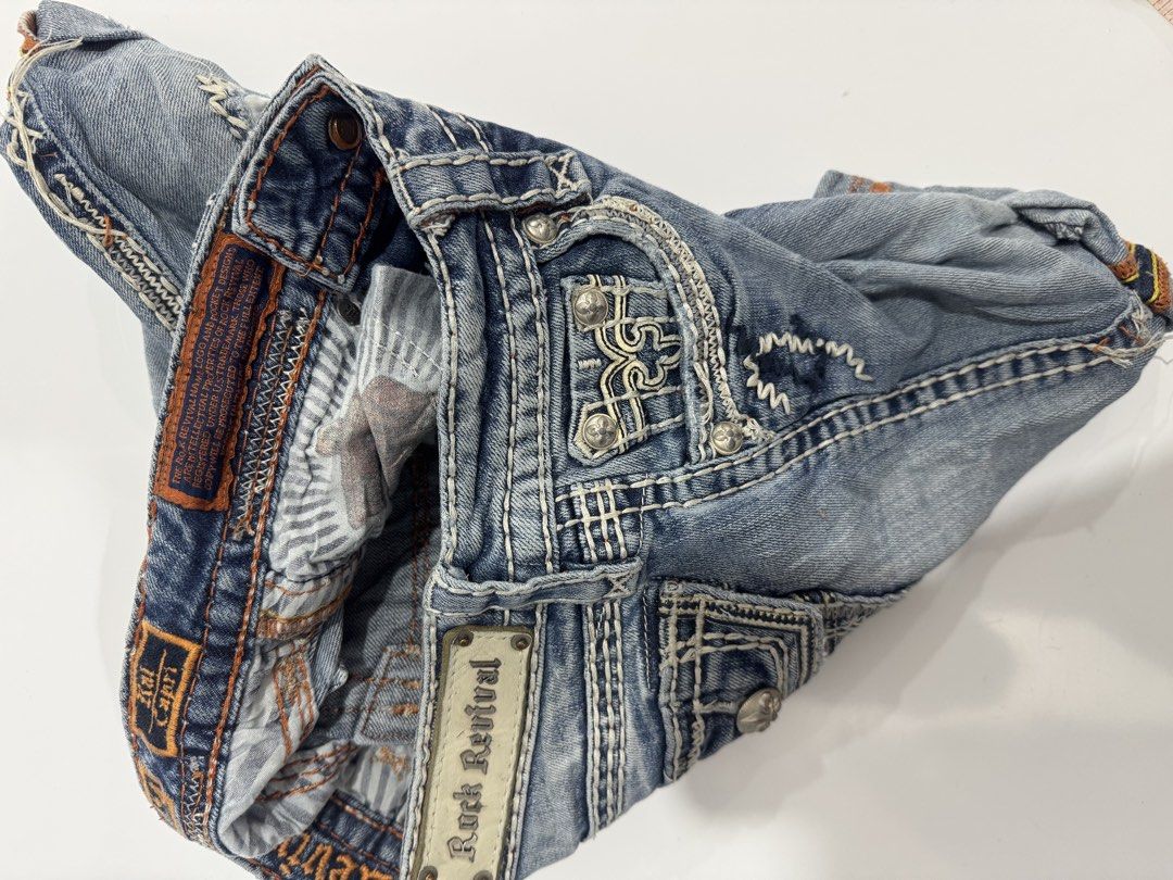 Rock Revival Denim Shorts (Category: Shorts) located in Cebu City. Submitted by oryenz (Listing ID 1436040330, Image 3). Description: - Rock Revival denim shorts - Size 24 - Light blue wash - Distressed accents - Rock Revival logo on back pocket and waistband - Button and zipper closure - Designed in the USA, made in China.