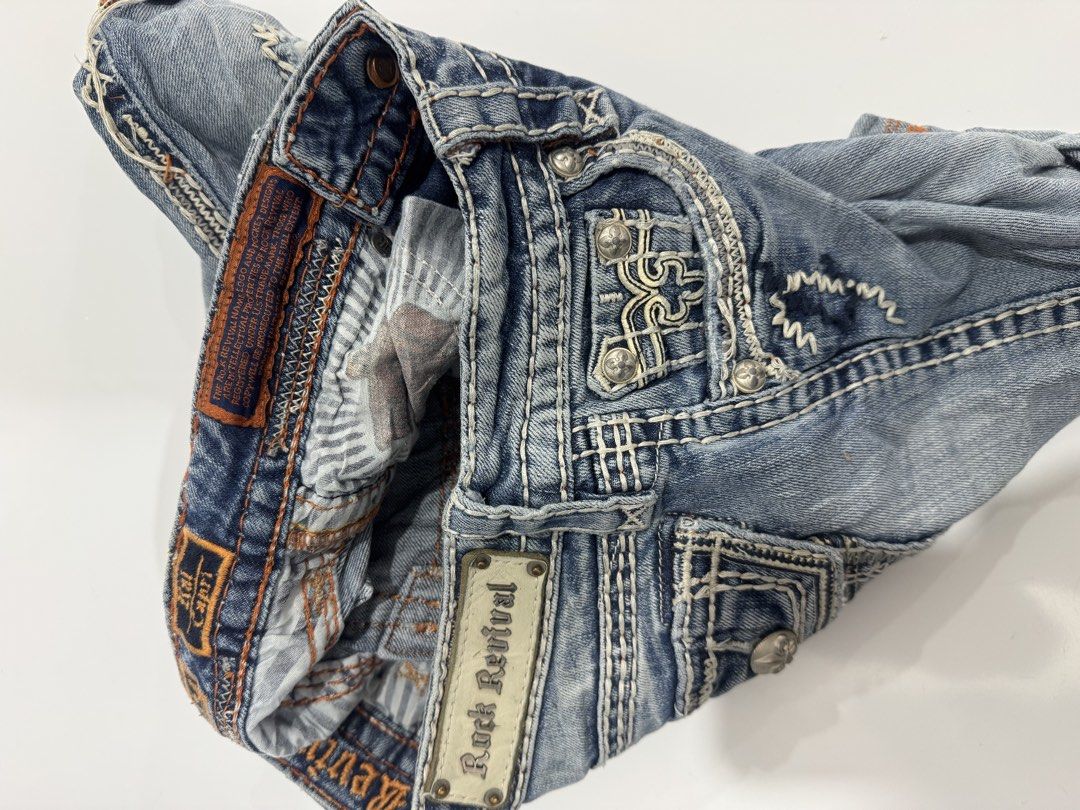 Rock Revival Denim Shorts (Category: Shorts) located in Cebu City. Submitted by oryenz (Listing ID 1436040330, Image 2). Description: - Rock Revival denim shorts - Size 24 - Light blue wash - Distressed accents - Rock Revival logo on back pocket and waistband - Button and zipper closure - Designed in the USA, made in China.