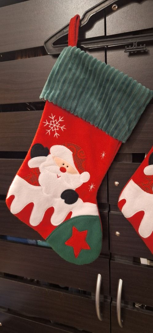 SANTA Christmas Stockings (Category: Other Home Decor) located in General Trias. Submitted by aeunice (Listing ID 1436037762, Image 2). Description: 2 pieces available. In Good Condition. Set of two Christmas stockings featuring Santa Claus design. Ready to be hung with a red loop. Meet up / Shipping via Lalamove, JnT, Gogo Express & LBC..