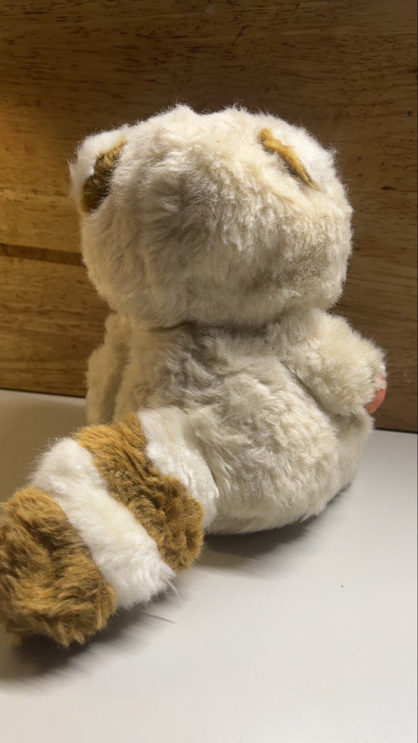 Sekiguchi Monchhichi Tanuki Plush Toy (Category: Plushies & Soft Toys) located in Paranaque City. Submitted by btslite (Listing ID 1436063286, Image 2). Description: - Height 7.5” - Adorable Sekiguchi Monchhichi plush toy. - Dressed as a cute Tanuki. - Features a soft, fluffy exterior. - Comes with a brown and white striped tail. - Classic Monchhichi face with closed eyes and red mouth. - Wearing a Tanuki hood. - Sekiguchi tag is visible. ⚠️ Cond