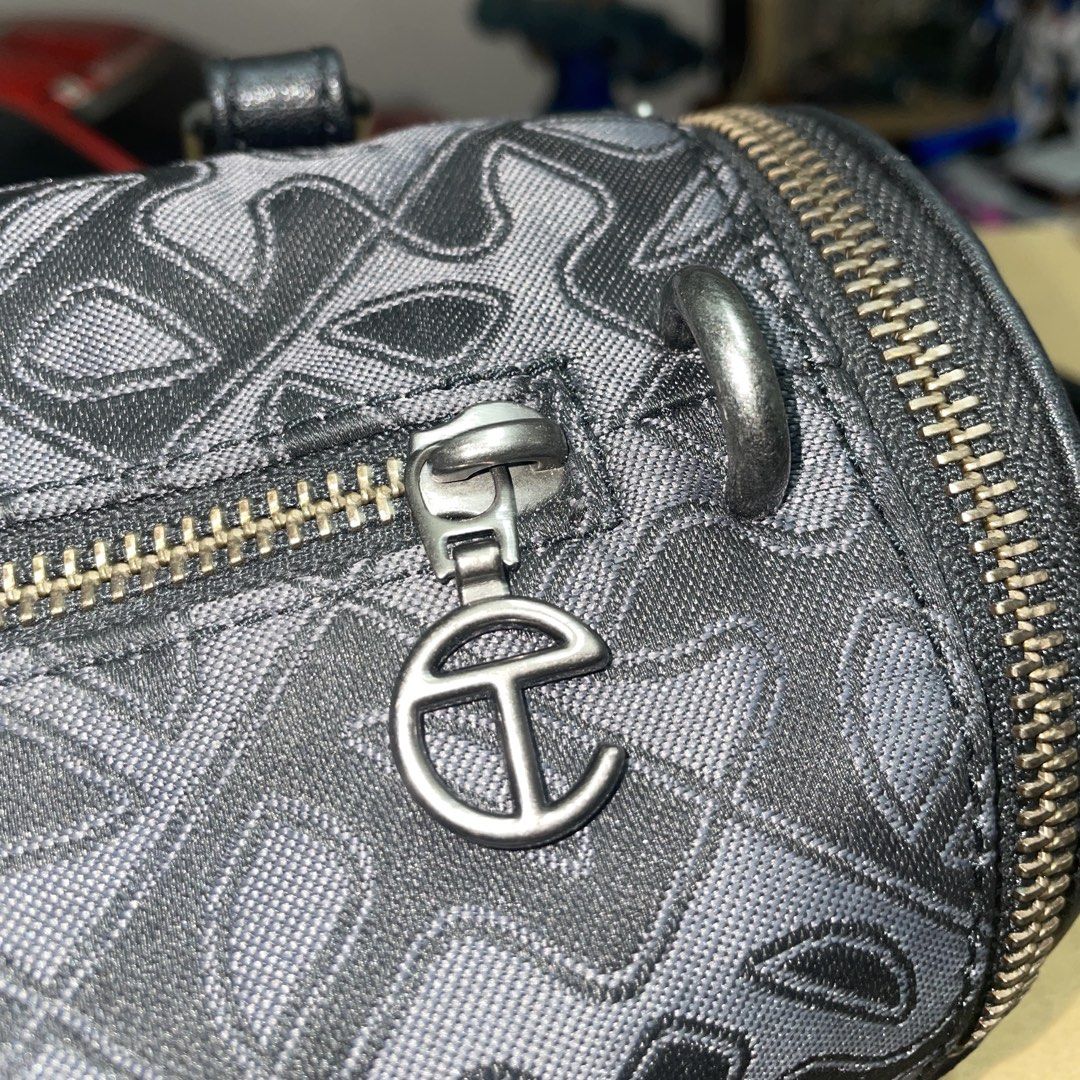 Small Jacquard Telfar Duffle (Category: Luxury Bags & Wallets) located in Cavite. Submitted by ajdelrosario (Listing ID 1435988648, Image 3). Description: - Black Telfar cylinder bag - Detachable strap included - Zip closure - Telfar logo on front and zipper pull - Patterned exterior - Telfar label inside Bought directly from Telfar’s official website 100% Authentic Vegan Leather Used 5x only No damage Long strap never been used Complete with dus