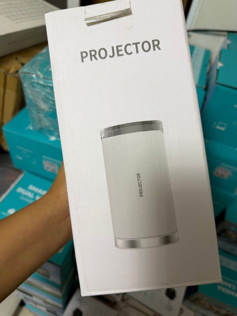 Smart Projector (Category: Projectors) located in Cavite. Submitted by tifanny.goods (Listing ID 1436009437, Image 1). Description: Projector used twice only. May wifi na din and apps like youtube and netflix 👌.