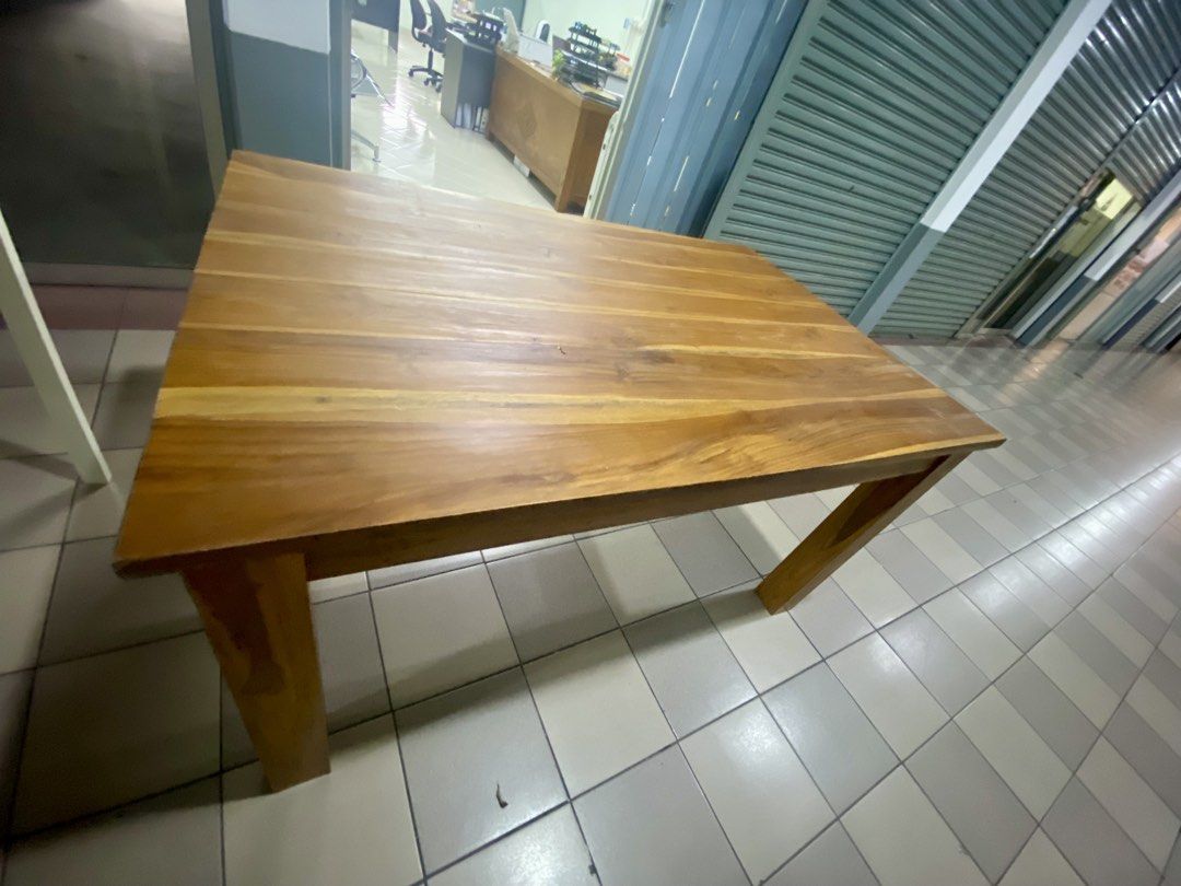 Solid Wood Dining Table (Category: Tables & Sets) located in Kuala Lumpur. Submitted by preloved-c (Listing ID 1435957242, Image 2). Description: - Solid wood dining table - Rectangular tabletop with natural wood grain - Dimensions: 180cm (L) x 80cm (W) x 75cm (H) - Features four square legs - Ideal for dining or workspace.