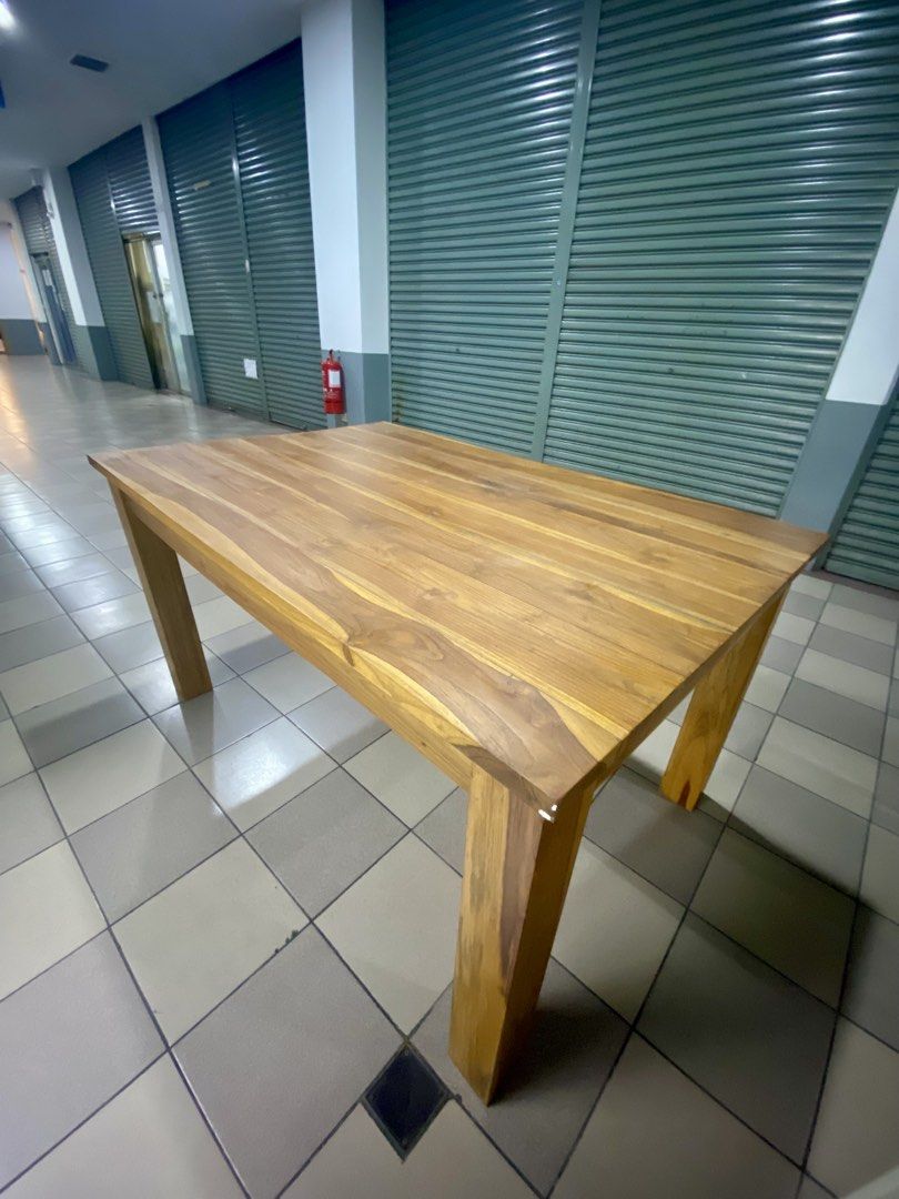 Solid Wood Dining Table (Category: Tables & Sets) located in Kuala Lumpur. Submitted by preloved-c (Listing ID 1435957242, Image 3). Description: - Solid wood dining table - Rectangular tabletop with natural wood grain - Dimensions: 180cm (L) x 80cm (W) x 75cm (H) - Features four square legs - Ideal for dining or workspace.