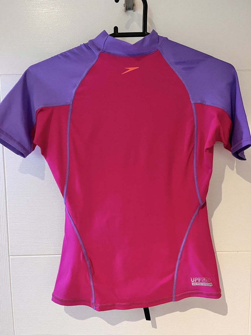 Speedo Rash Guard - Pink and Purple (Category: Babies & Kids Fashion) located in Quezon City. Submitted by junkstar2020 (Listing ID 1435951185, Image 3). Description: - Speedo rash guard - Eye-catching pink and purple design - Short sleeves - High neckline - UPF 50 sun protection - Speedo logo on front - Made of stretchy, athletic material Great condition no stretching or fading.