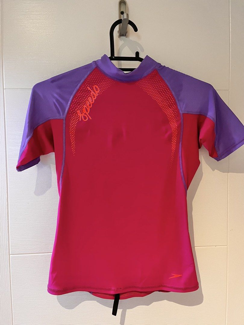Speedo Rash Guard - Pink and Purple (Category: Babies & Kids Fashion) located in Quezon City. Submitted by junkstar2020 (Listing ID 1435951185, Image 1). Description: - Speedo rash guard - Eye-catching pink and purple design - Short sleeves - High neckline - UPF 50 sun protection - Speedo logo on front - Made of stretchy, athletic material Great condition no stretching or fading.