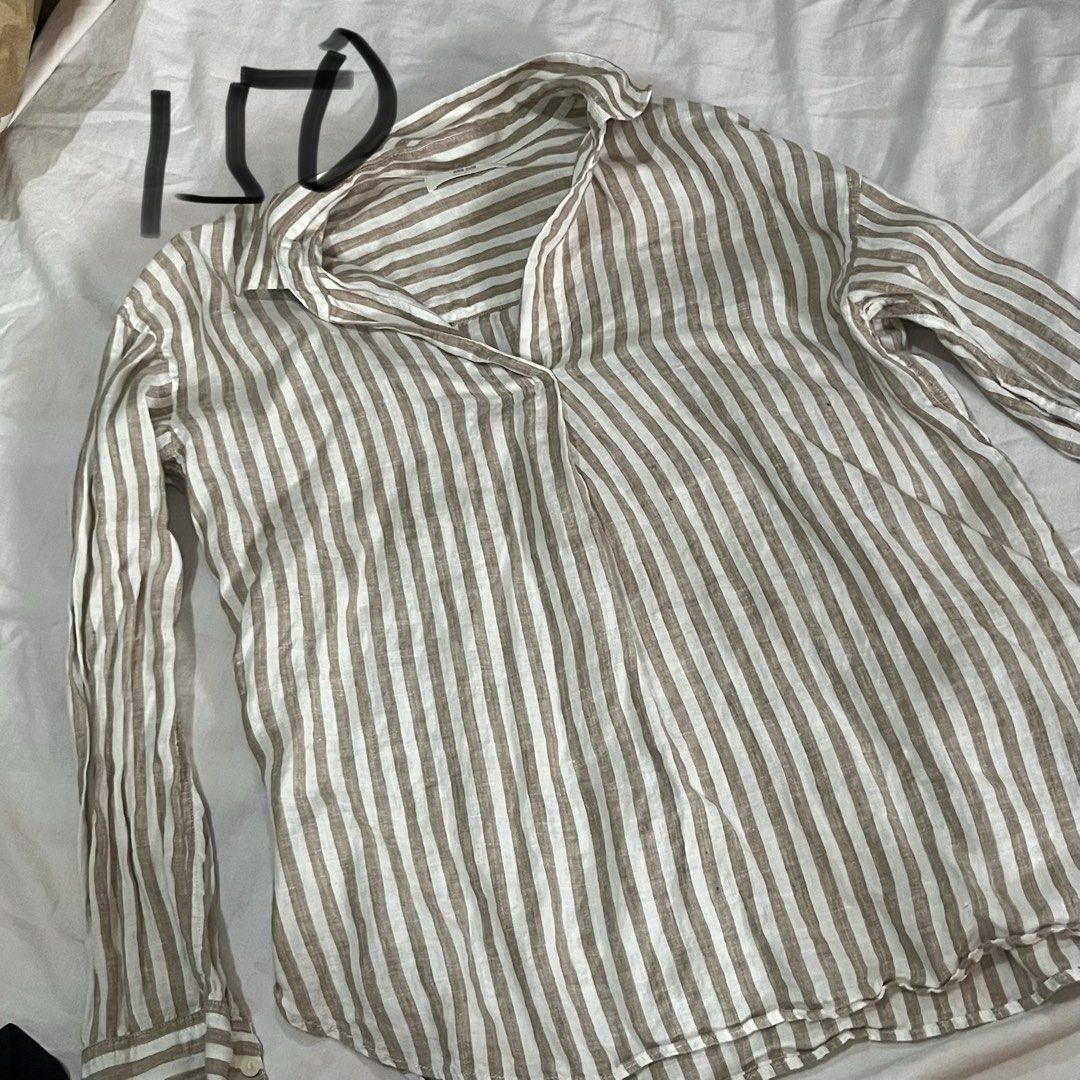 Striped Long Sleeve Shirt (Category: Longsleeves) located in Manila. Submitted by suhniecart (Listing ID 1436013964, Image 1). Description: - Classic striped long-sleeved shirt - Neutral color palette - Collared neckline - Buttoned cuffs - Made from lightweight fabric - Relaxed fit for comfort - Ideal for warmer weather.