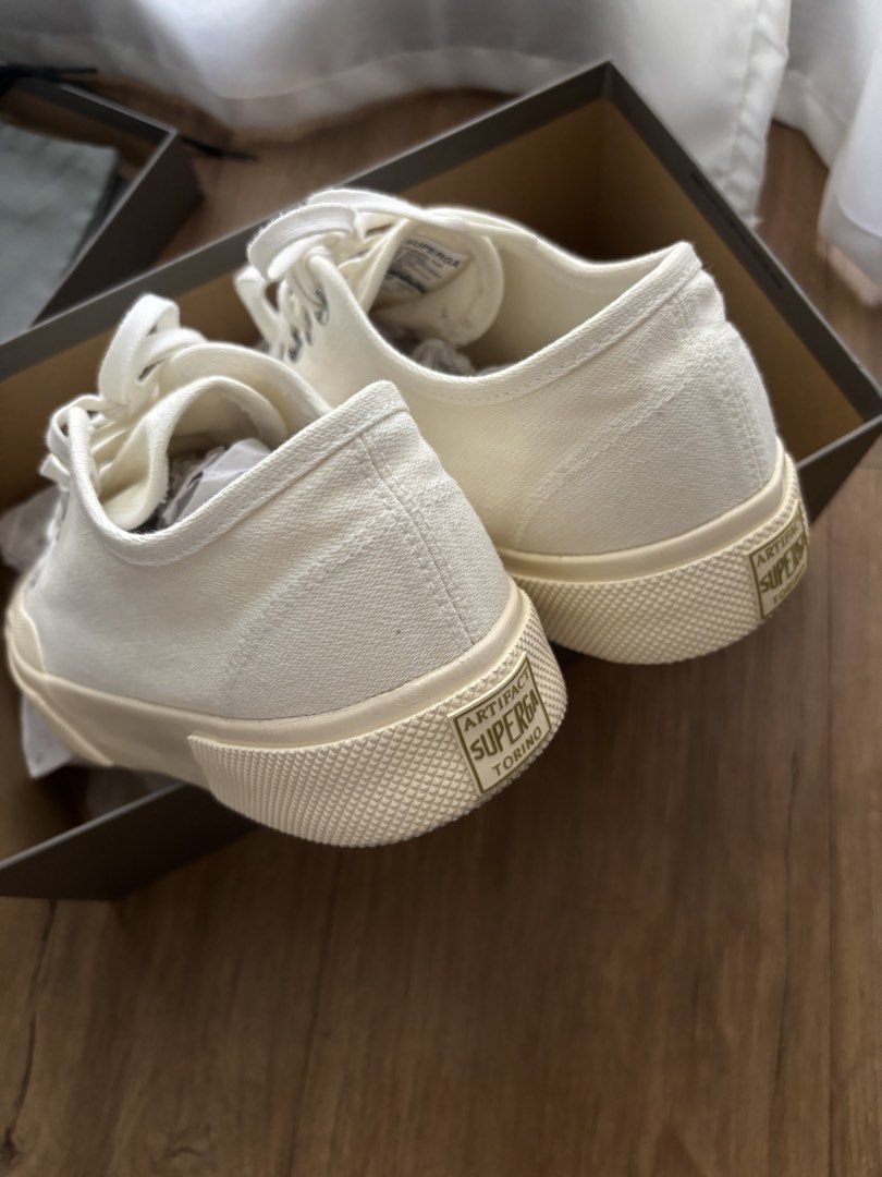 Superga Artifact Sneakers in Off White (Category: Sneakers) located in Pasig City. Submitted by kathB (Listing ID 1436026307, Image 2). Description: White-Off-white Superga Artifact sneakers with a canvas upper, lace-up closure, and rubber sole. Comes with original box and dust bag. Features green soles that add a unique touch and set it apart from other Superga styles. 😮‍💨 Used about 3x for work, no heel drag. Original price: Php 7,650. :).