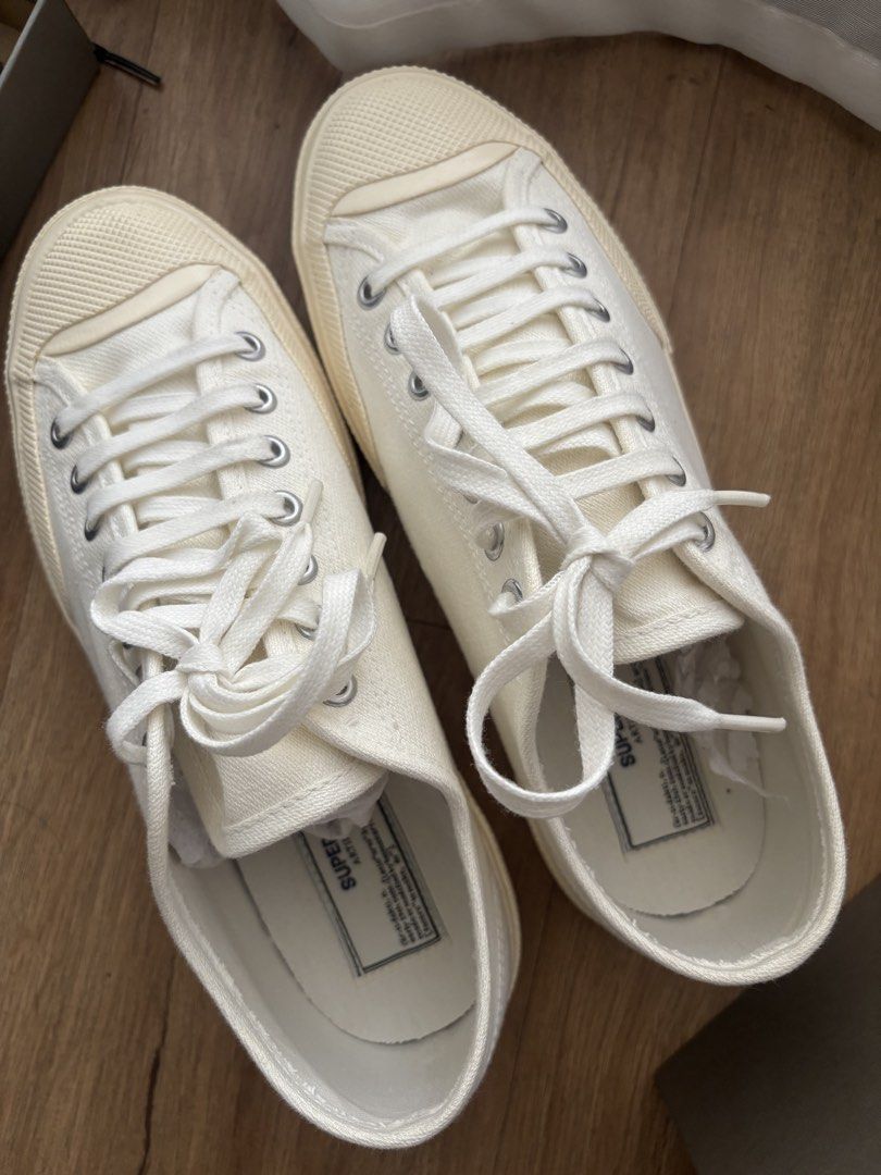 Superga Artifact Sneakers in Off White (Category: Sneakers) located in Pasig City. Submitted by kathB (Listing ID 1436026307, Image 1). Description: White-Off-white Superga Artifact sneakers with a canvas upper, lace-up closure, and rubber sole. Comes with original box and dust bag. Features green soles that add a unique touch and set it apart from other Superga styles. 😮‍💨 Used about 3x for work, no heel drag. Original price: Php 7,650. :).