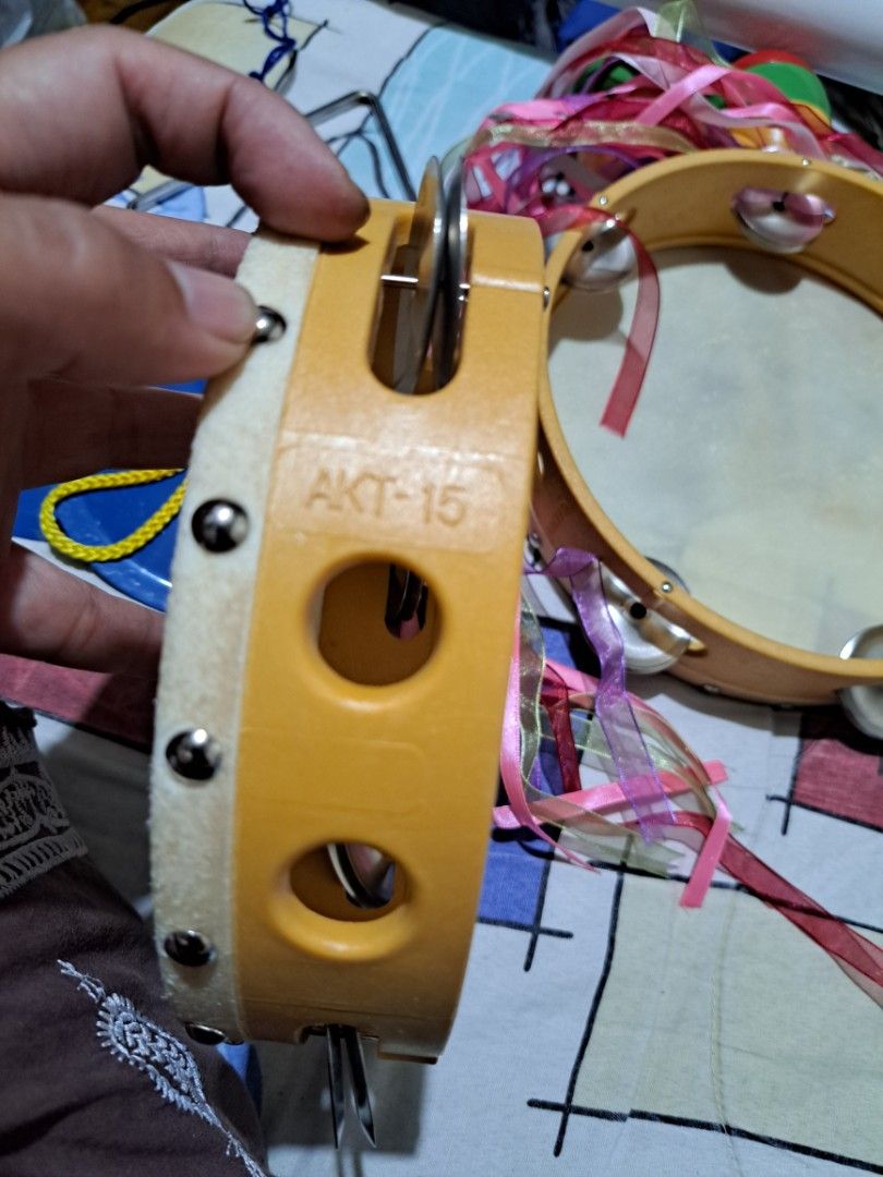 Tambourine with Ribbons (Category: Musical Instruments) located in Cainta. Submitted by dhengskie (Listing ID 1436062982, Image 2). Description: - Angels brand Wooden frame tambourine with metal jingles - Features a white drumhead and colorful ribbons - Yellow frame - Model: AKT-15 price are for both.