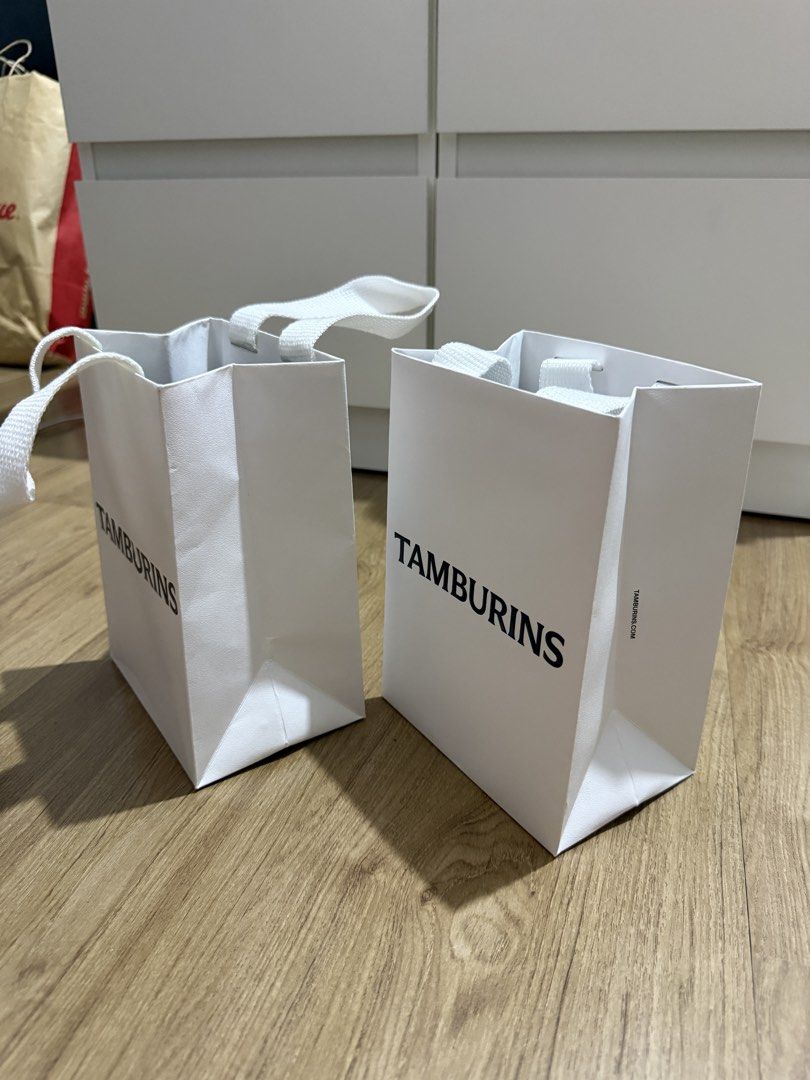 Tamburins Gift Bag (Category: Craft Supplies & Tools) located in Valenzuela. Submitted by minami34 (Listing ID 1436029966, Image 3). Description: - Two Tamburins gift bags included - Features Tamburins Embossed logo - White handles - Includes two black cards - Ideal for gifts or small items - Unused condition Dimensions: (L- 16.5cm x W- 11.6cm x D - 6cm) Reason for selling: Declutter Note: Shipping Fee (SF) still not included. Mode of Payment: Ba