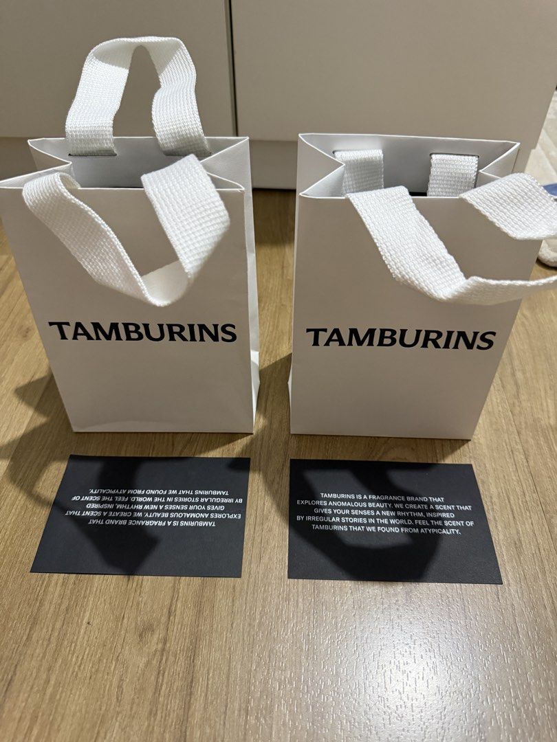 Tamburins Gift Bag (Category: Craft Supplies & Tools) located in Valenzuela. Submitted by minami34 (Listing ID 1436029966, Image 2). Description: - Two Tamburins gift bags included - Features Tamburins Embossed logo - White handles - Includes two black cards - Ideal for gifts or small items - Unused condition Dimensions: (L- 16.5cm x W- 11.6cm x D - 6cm) Reason for selling: Declutter Note: Shipping Fee (SF) still not included. Mode of Payment: Ba