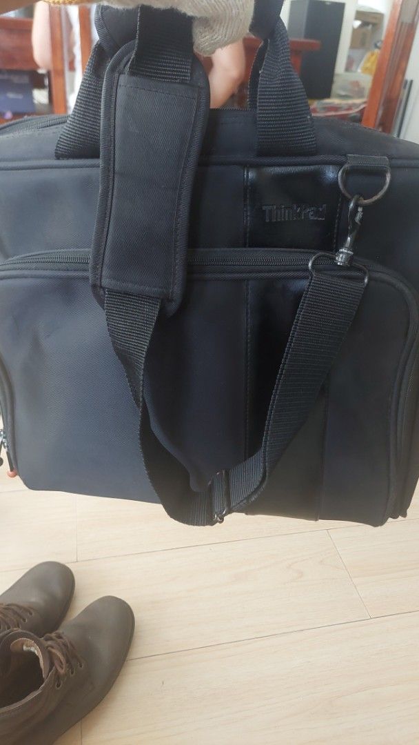ThinkPad Laptop Bag (Category: Laptop Bags & Sleeves) located in Paranaque City. Submitted by daddyu (Listing ID 1435943004, Image 1). Description: - Black ThinkPad laptop bag - Main compartment with zipper closure - Includes a handle - Detachable shoulder strap - ThinkPad logo on the front - Approximately 40cm in length.