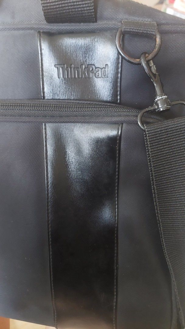 ThinkPad Laptop Bag (Category: Laptop Bags & Sleeves) located in Paranaque City. Submitted by daddyu (Listing ID 1435943004, Image 3). Description: - Black ThinkPad laptop bag - Main compartment with zipper closure - Includes a handle - Detachable shoulder strap - ThinkPad logo on the front - Approximately 40cm in length.