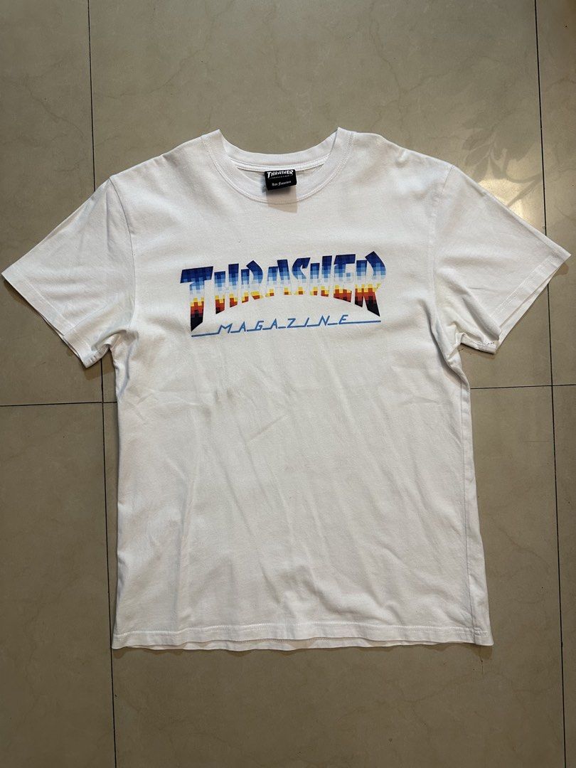 Thrasher Magazine T-shirt (Category: Tshirts & Polo Shirts ) located in Manila. Submitted by almightyvinson (Listing ID 1435983648, Image 1). Description: - White Thrasher T-shirt - Features a vibrant, colorful Thrasher logo - Classic crew neck design - Comfortable short sleeves - Made from a lightweight material.