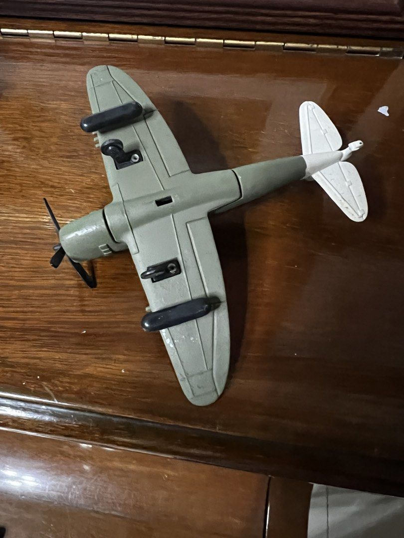 Thunder Jug Toy Airplane (Category: Toys & Games) located in Paranaque City. Submitted by jtong00 (Listing ID 1436025540, Image 2). Description: - Olive green toy airplane - White stars and "Thunder Jug" text - White tail with "42921" - Classic collectible item - Great for display.