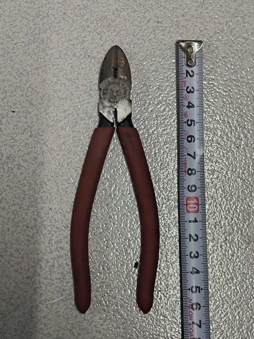 Tsunoda Japan Tools Side Cutter Pliers (Category: Construction Tools & Equipment) located in Angeles City. Submitted by yellowbrickstore (Listing ID 1435938834, Image 1). Description: - Tsunoda japanTools side cutter pliers made in Japan - Red handle - Marked 'THAI' and 'tsunoda TOOLS' - Cutting edge and pivot point - In good working condition.