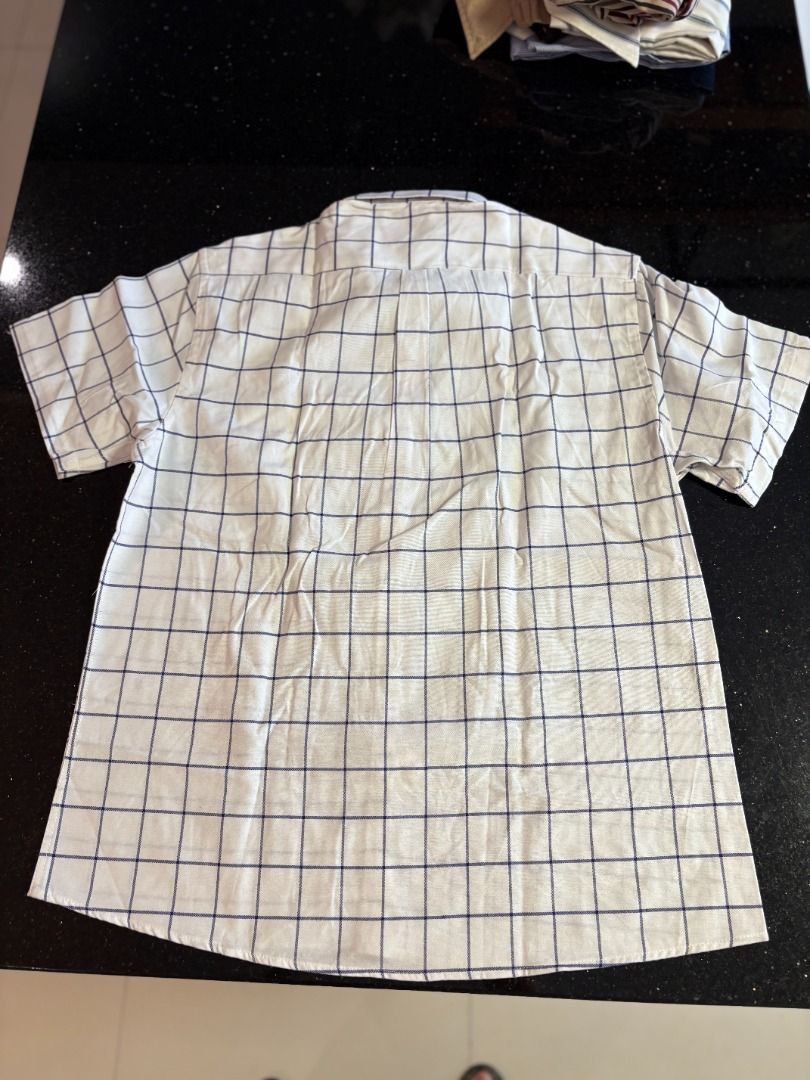 Unbranded White & Blue Panel Button-Down (Category: Tshirts & Polo Shirts ) located in Quezon City. Submitted by kirbo_to_the_turbo (Listing ID 1436025312, Image 2). Description: Tagged 44 Fits L to XL Negotiable Shipping Available via J&T or Lalamove at buyer's expense.