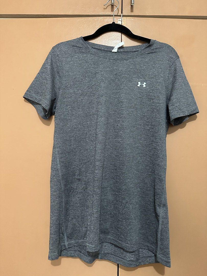 Under Armour Gray T-shirt (Category: Activewear) located in Mandaluyong City. Submitted by ja.declutters (Listing ID 1435999763, Image 1). Description: - Gray Under Armour t-shirt - Small Under Armour logo on chest - Short sleeves - Crew neck - Vertical seam on back - Textured fabric - Perfect for athletic activities.