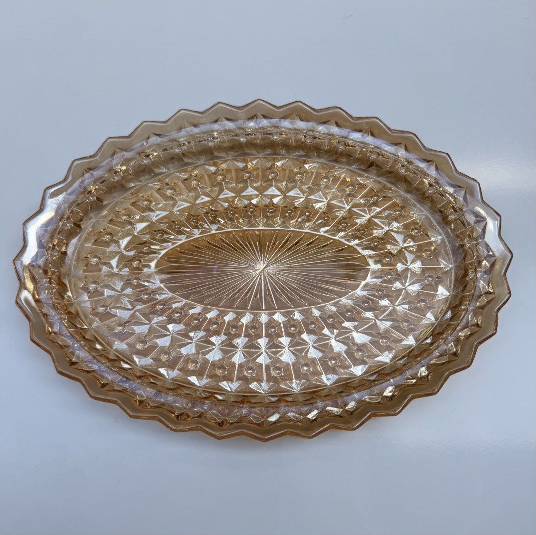 Vintage Carnival Marigold Oval Serving Platter (Category: Dinnerware & Cutlery) located in Manila. Submitted by eithne128 (Listing ID 1435912444, Image 1). Description: - Oval serving platter - Textured design - Scalloped edge - Warm amber color - Ideal for appetizers and desserts - Decorative piece.