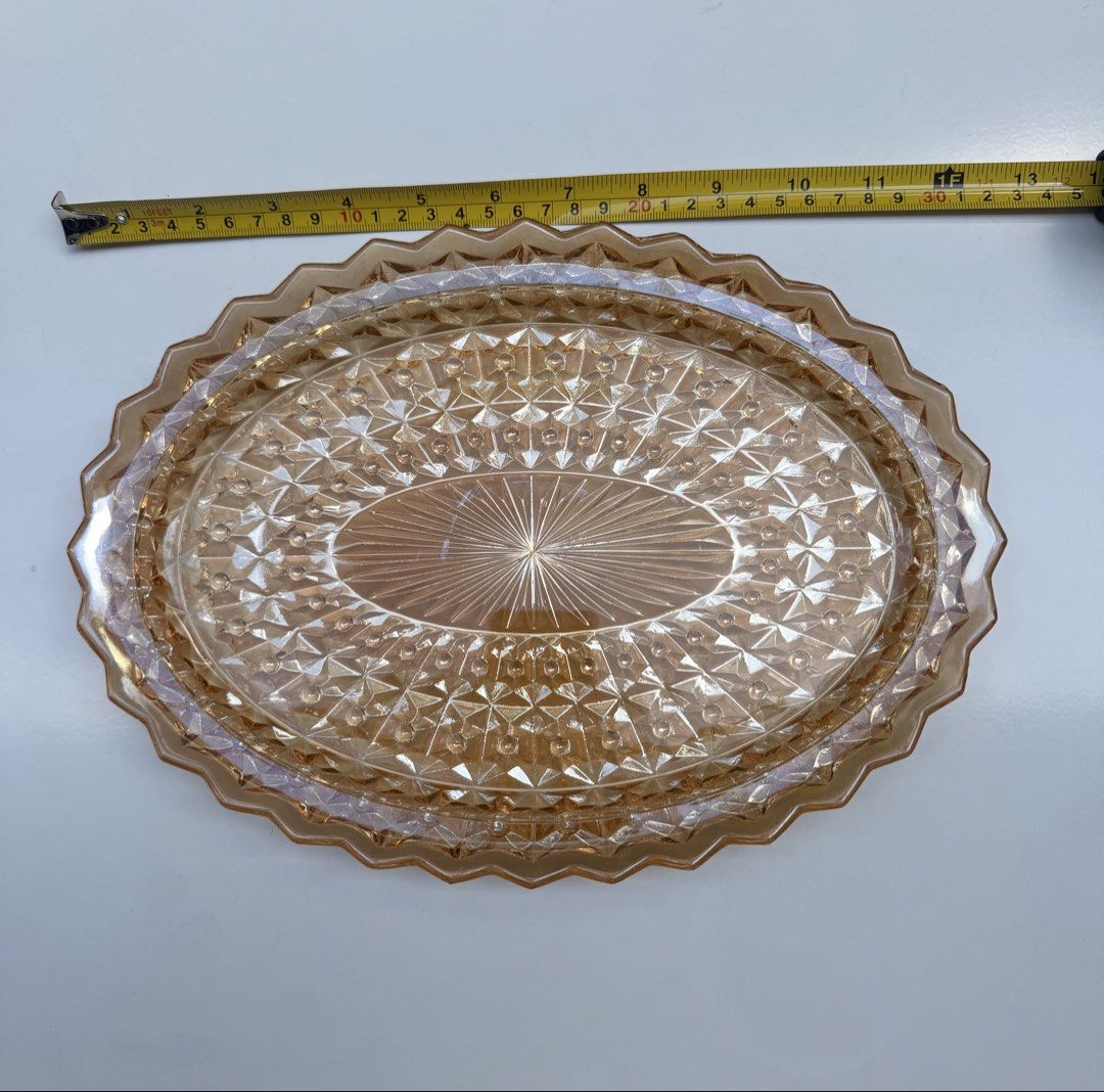 Vintage Carnival Marigold Oval Serving Platter (Category: Dinnerware & Cutlery) located in Manila. Submitted by eithne128 (Listing ID 1435912444, Image 2). Description: - Oval serving platter - Textured design - Scalloped edge - Warm amber color - Ideal for appetizers and desserts - Decorative piece.