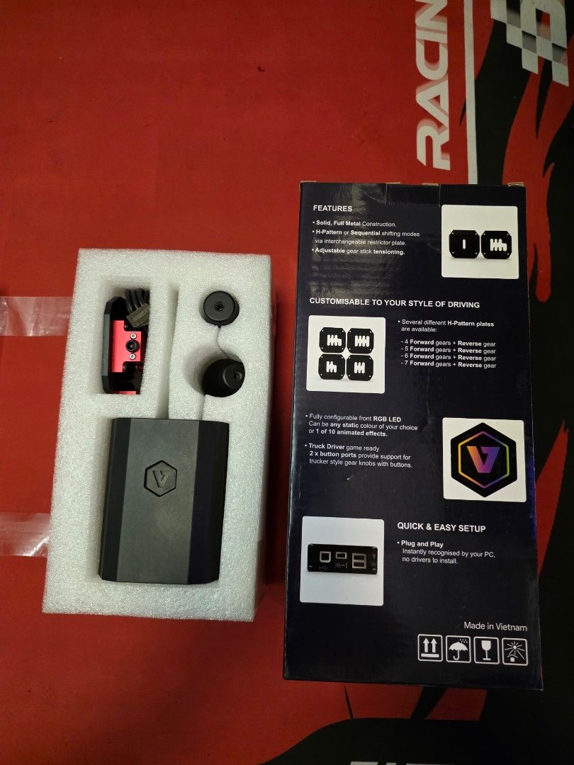 VNM Shifter V1 Basic Bundle (Category: Controllers) located in Petaling Jaya. Submitted by imcarbon (Listing ID 1435954580, Image 3). Description: - VNM Shifter V1 Basic Bundle - Includes shifter unit, mounting plate, and accessories - Features: - Customizable driving style - Quick and easy setup - Comes with a USB cable - Box includes product features and setup instructions.