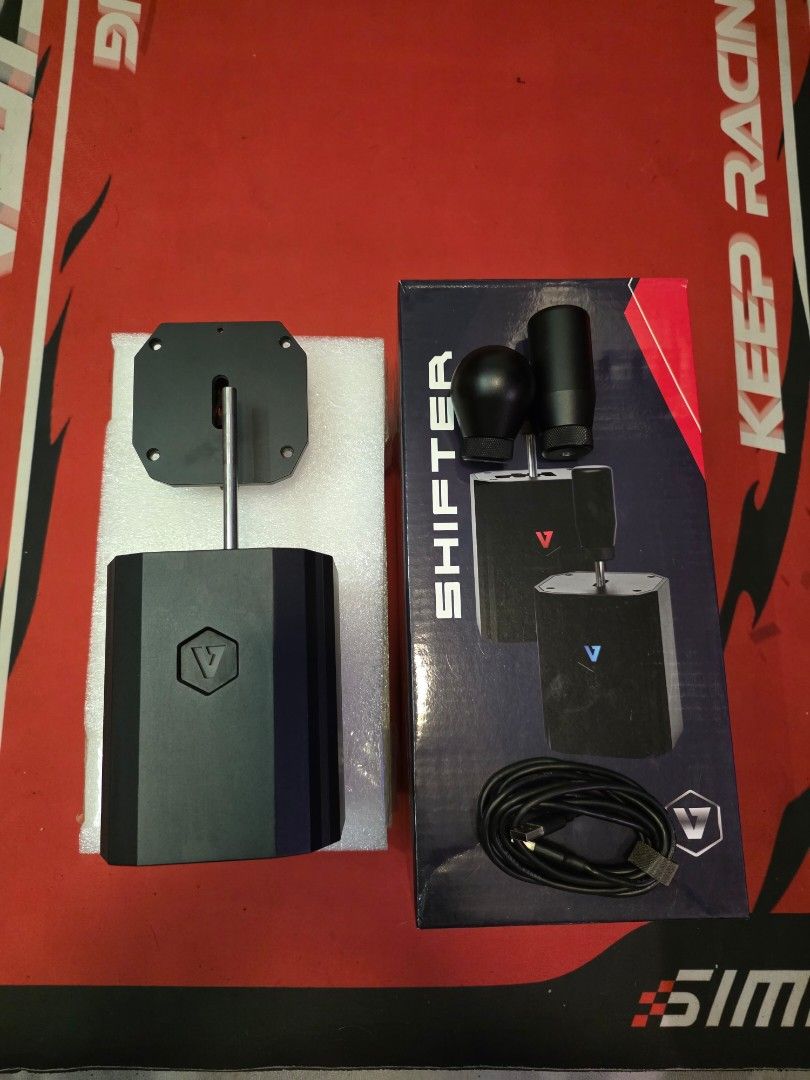 VNM Shifter V1 Basic Bundle (Category: Controllers) located in Petaling Jaya. Submitted by imcarbon (Listing ID 1435954580, Image 1). Description: - VNM Shifter V1 Basic Bundle - Includes shifter unit, mounting plate, and accessories - Features: - Customizable driving style - Quick and easy setup - Comes with a USB cable - Box includes product features and setup instructions.