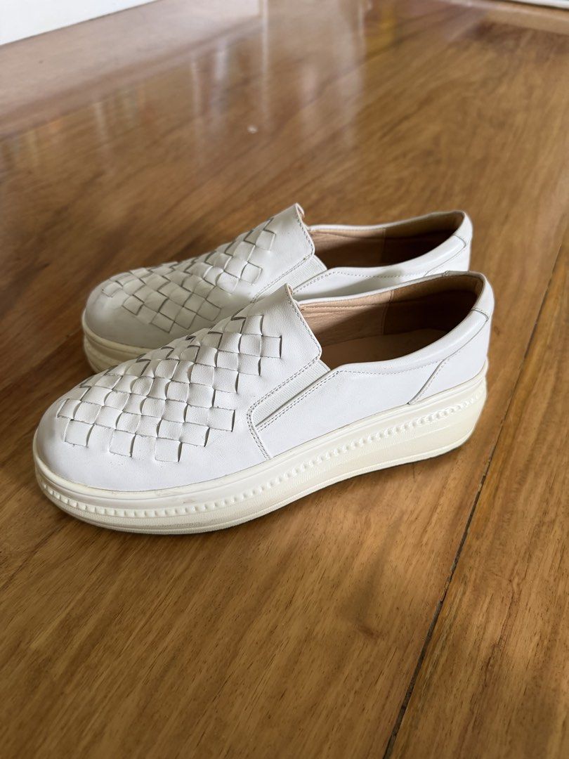 White Woven Slip-on Sneakers (Category: Sneakers) located in Manila. Submitted by decluttersiris (Listing ID 1435927300, Image 2). Description: - White slip-on sneakers - Woven design on upper - Thick, off-white sole - Rounded toe - Smooth, leather-like interior - Simple and versatile design - Suitable for casual wear.