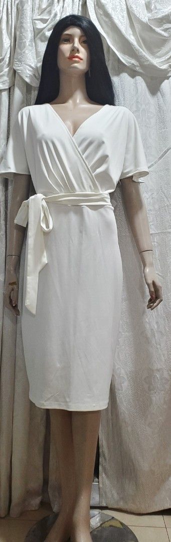 White Wrap Dress XL-2XL (Category: Dresses) located in Manila. Submitted by gresha (Listing ID 1436078463, Image 3). Description: - Elegant white wrap dress - Flattering V-neck - Short sleeves - Matching tie belt - Knee-length - Size: XL-2XL.