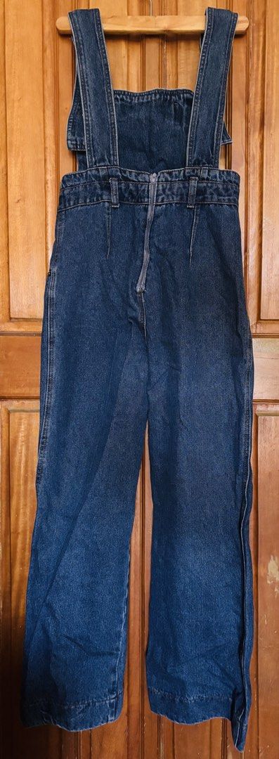 Wide Leg Straight Cut Denim Jumper (Category: Jumpsuits) located in Quezon City. Submitted by loveroux (Listing ID 1436029065, Image 2). Description: With slight flaw at the back zip. Fits up to medium..