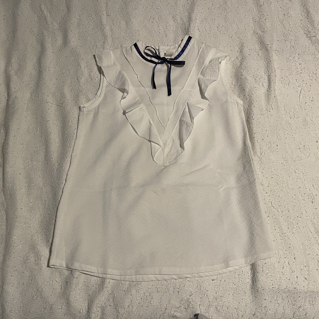 womens blouse white sleeveles ruffles (Category: Sleeveless) located in Quezon City. Submitted by froodless (Listing ID 1436022135, Image 1). Description: S.