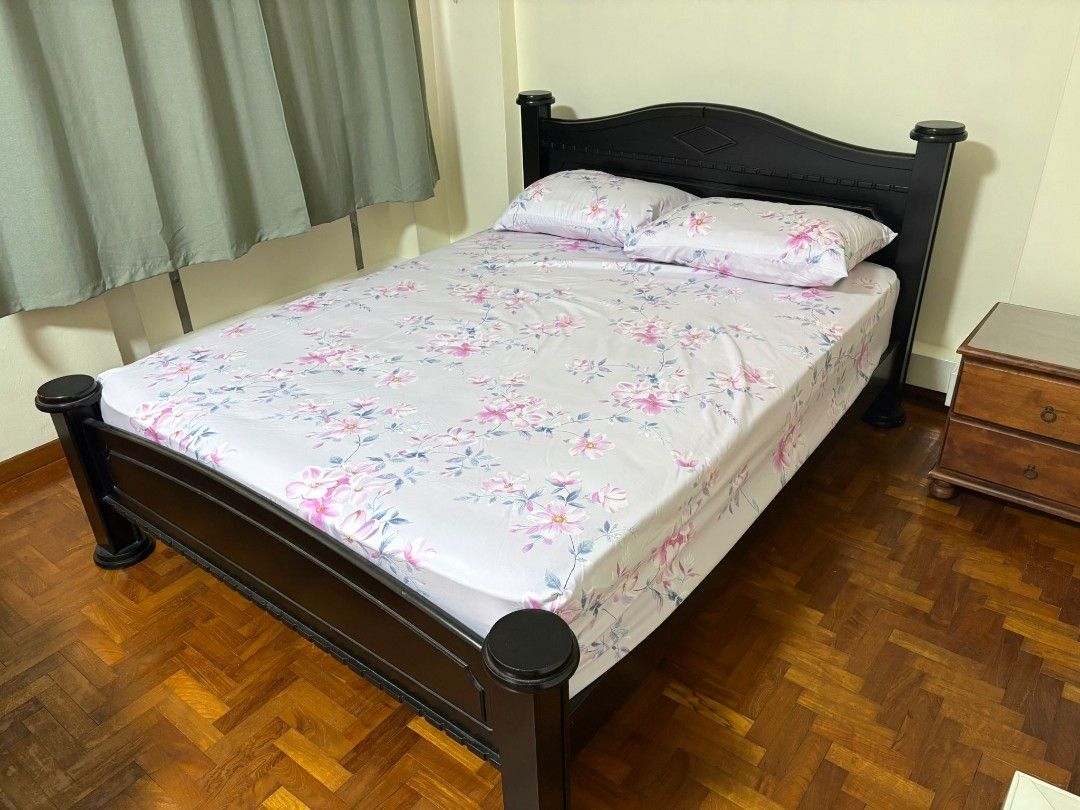 Wooden Bed Frame with Floral Bedding